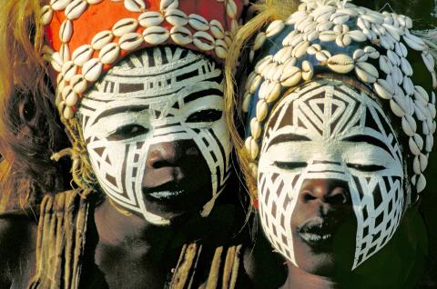 two girls with typical face painting at a Vodun feast, Cote d'Ivoire