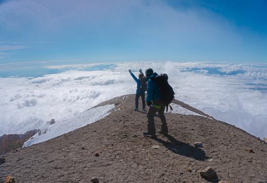 mountaineers on the summit of the pico de orizaba volcano